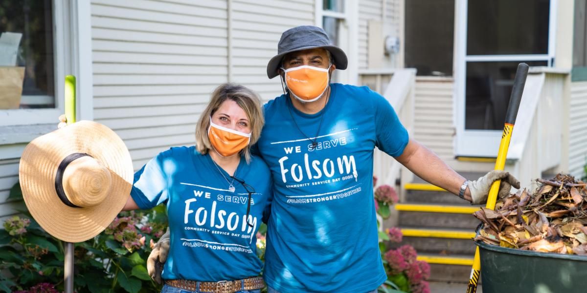 Community Service Day 2020 photo of two volunteers wearing blue 