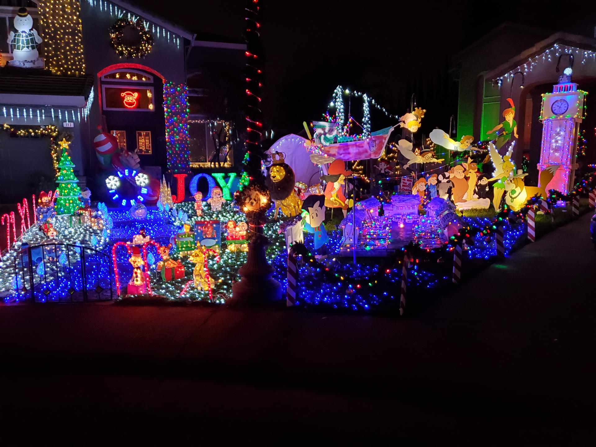 Illuminate the Block - Ledgemont Ct  photo at night with all the christmas lights and decorations on in their front yard and house 