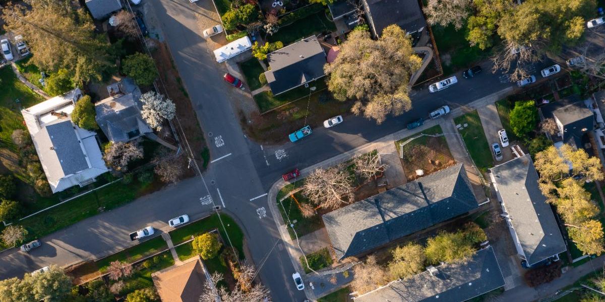 Historic District Aerials shot of streets and trees with cars on the side of the streets