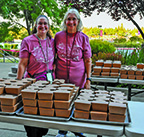 Two adult female volunteers at the Community Service Day event